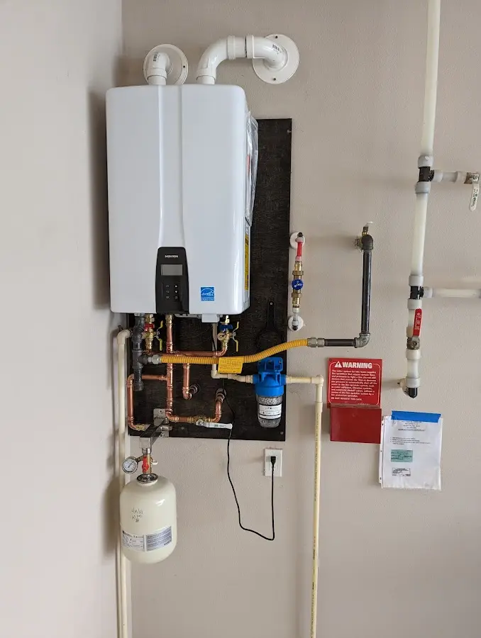 Professional plumber installing copper piping in a Terrace Heights home